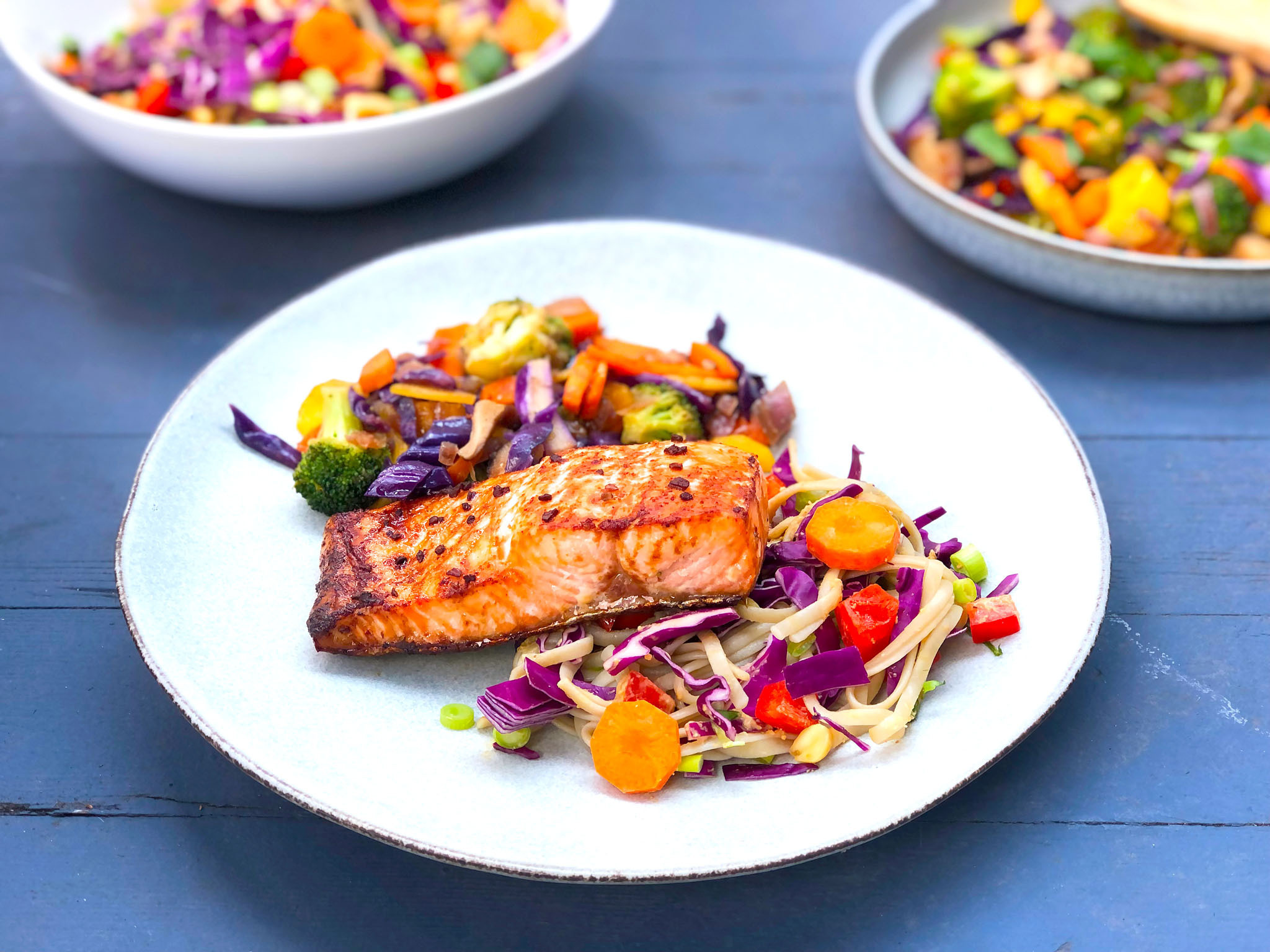 Thai Ginger Salmon, served with Vegetable Stir Fry and Noodle Salad with Peanut Sauce Image
