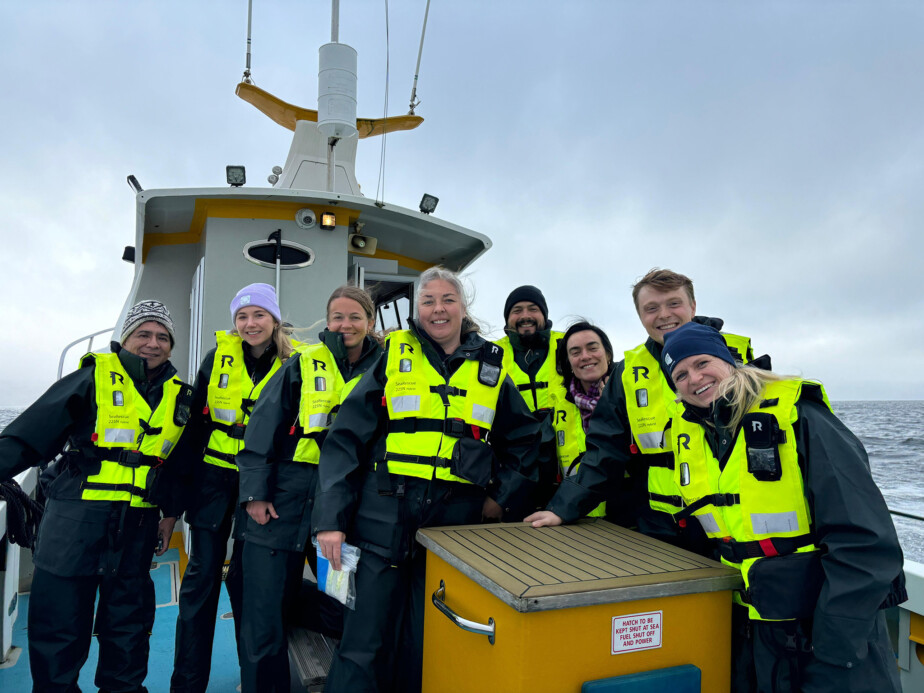 GSI members in the Fish Health and Welfare Task Force pose on a boat heading to the Loch Fyne salmon farm